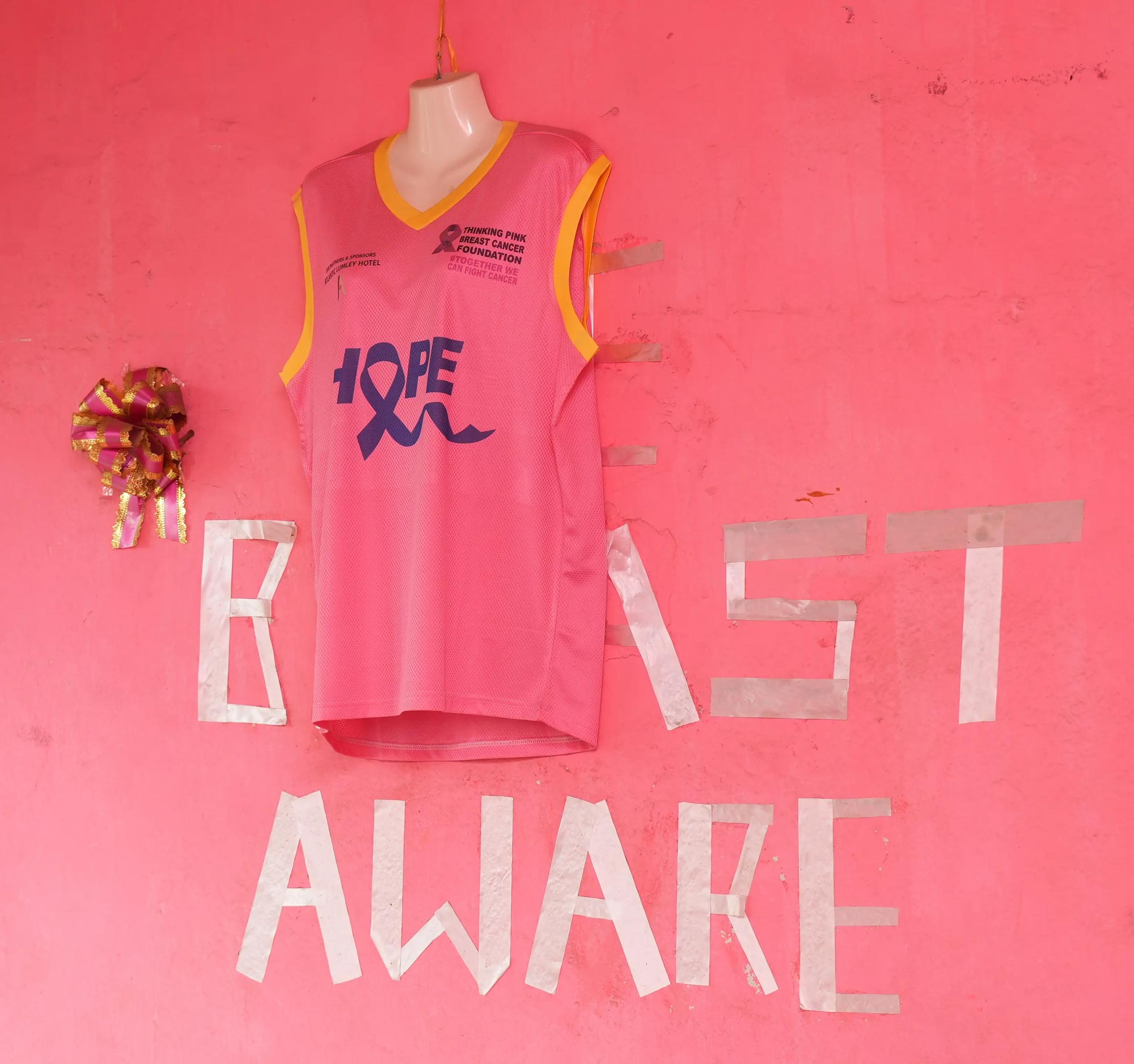 Thinking Pink breast aware on a wall with a jersey