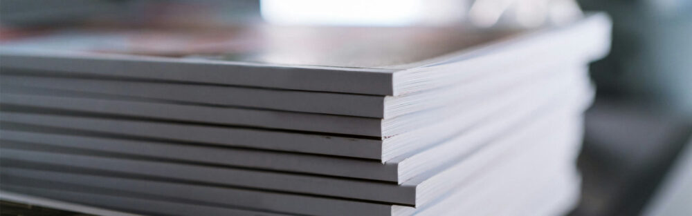 a stack of magazines or books from the max foundation