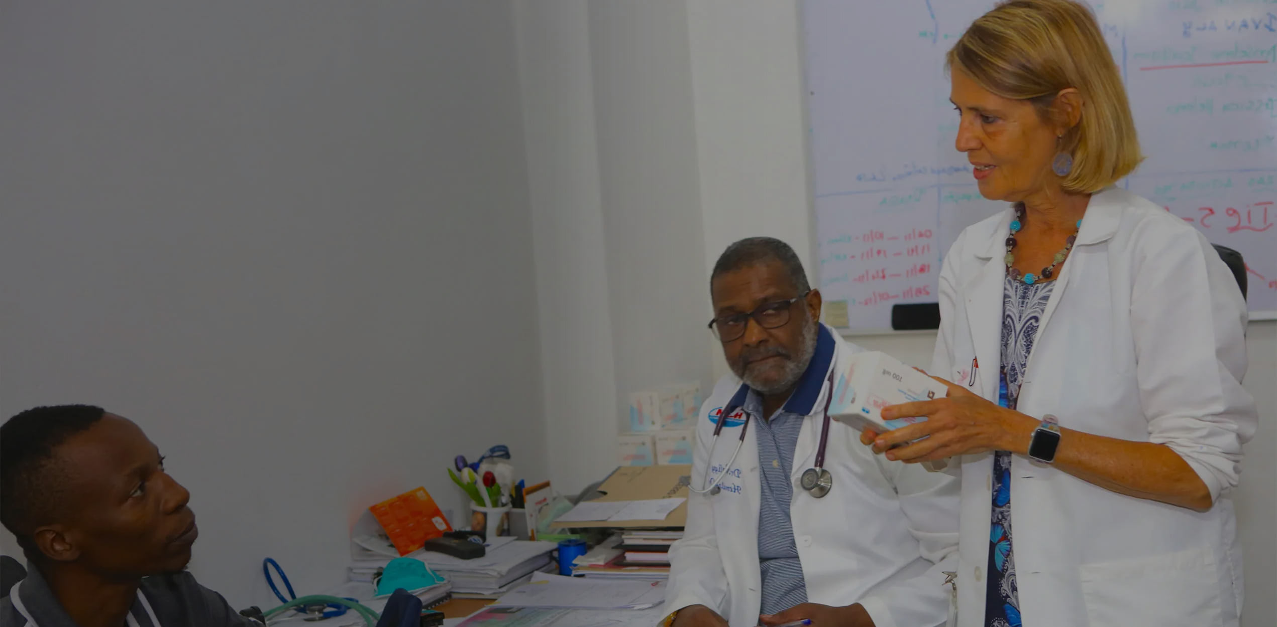 addressing the treatment gap - doctors conversing with patient